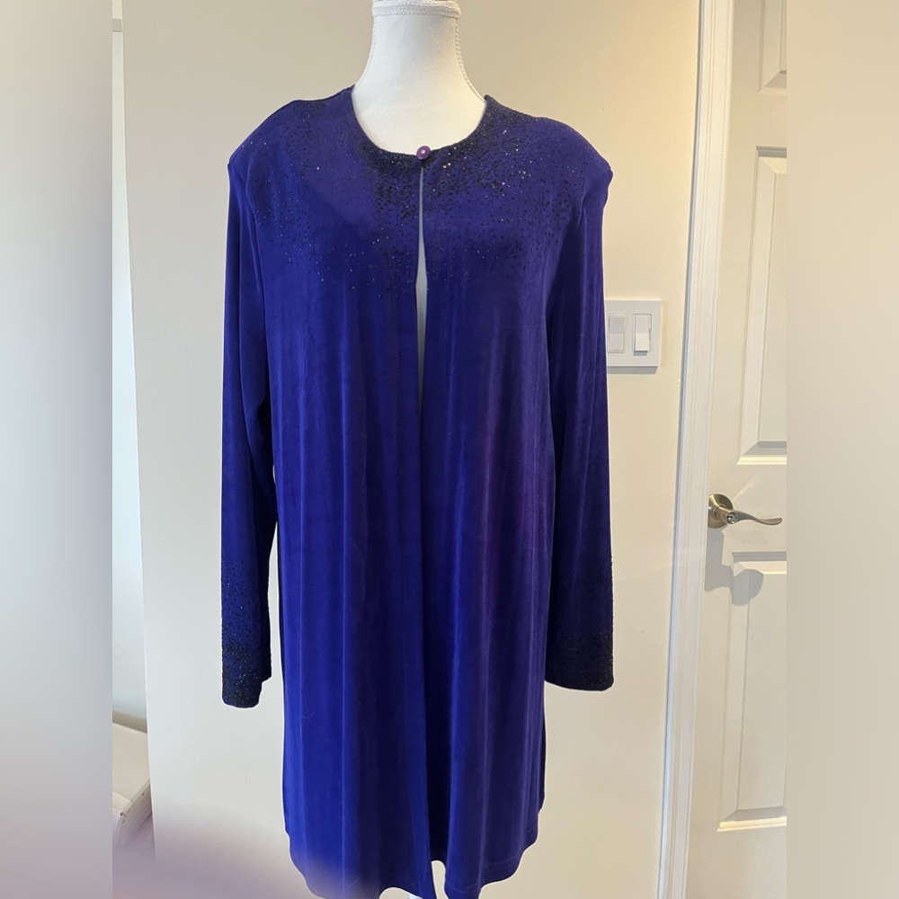 Gorgeous over jacket with shimmering sequin black on top of cobalt blue
